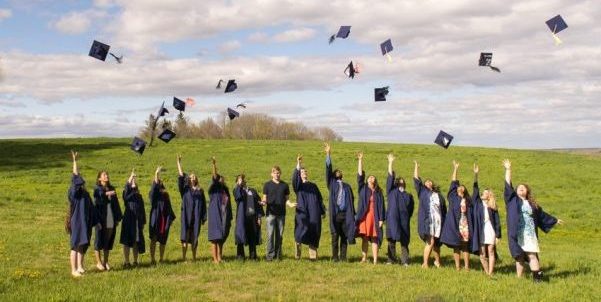 Students throwing caps