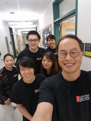 Lab members in a hallway taking a selfie